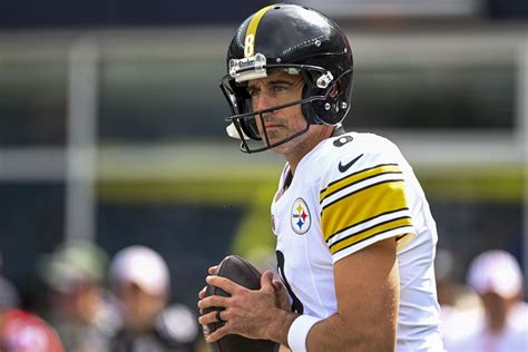 Pittsburgh Steelers offensive huddle with quarterback Aaron Rodgers.