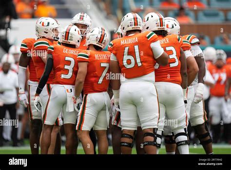 The Miami Hurricanes huddle together during a critical ACC matchup.
