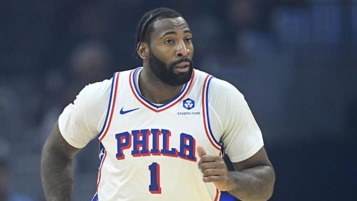 Drummond launching a three-pointer during a 76ers game, showcasing his expanding offensive range