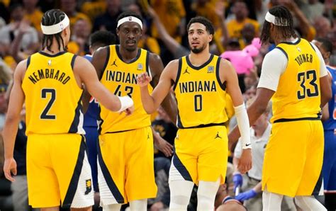 Nembhard takes command during a Pacers timeout, showcasing his leadership.