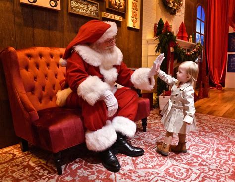 Families enjoy the immersive Santapolis experience at Annapolis Mall.
