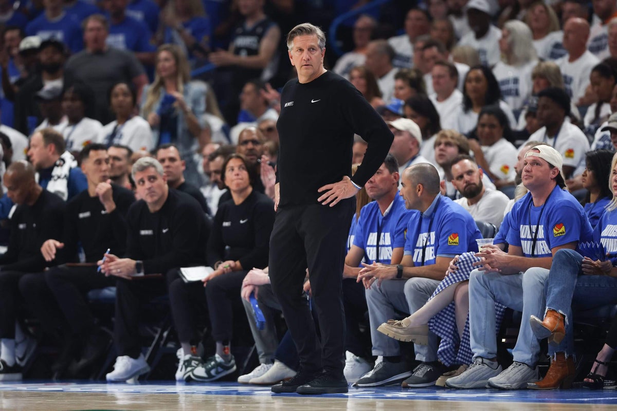 Timberwolves head coach Chris Finch strategizing during a timeout as Edwards struggles to find his shot.