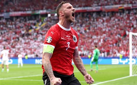 Austria's Marko Arnautovic celebrates after scoring against Cyprus.