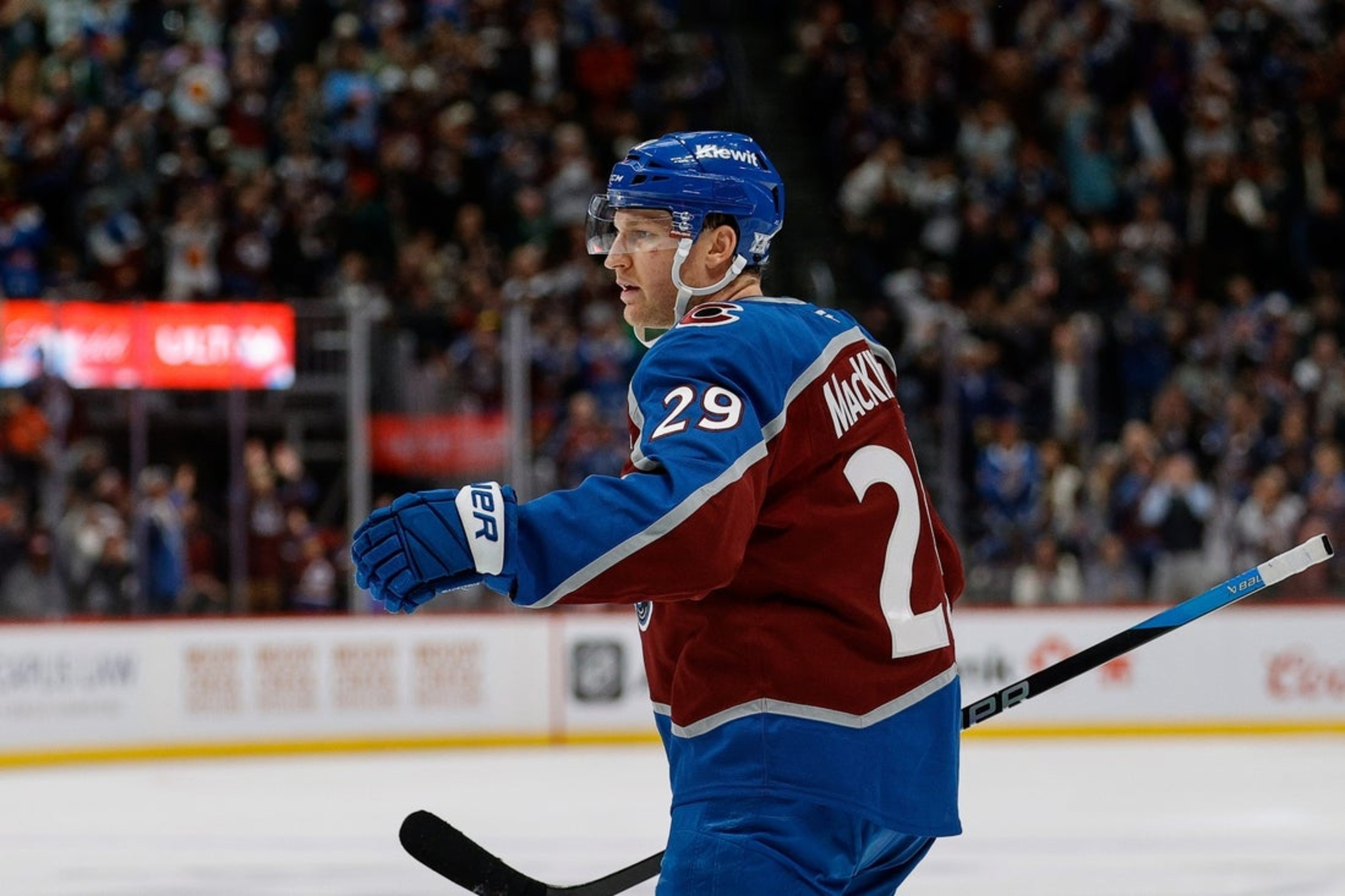 Nathan MacKinnon controls the puck against the Oilers