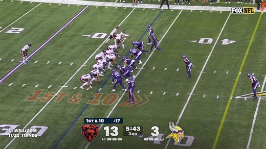 Caleb Williams evading defenders during his crucial 16-yard scramble