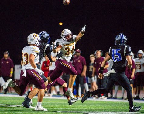 Panthers' defensive line applies relentless pressure on South's quarterback.