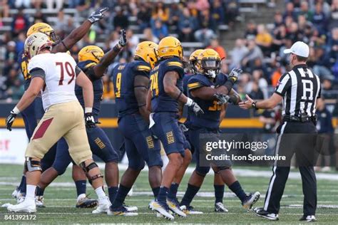 Toledo's dominant defense celebrates a critical stop against MAC opponents.