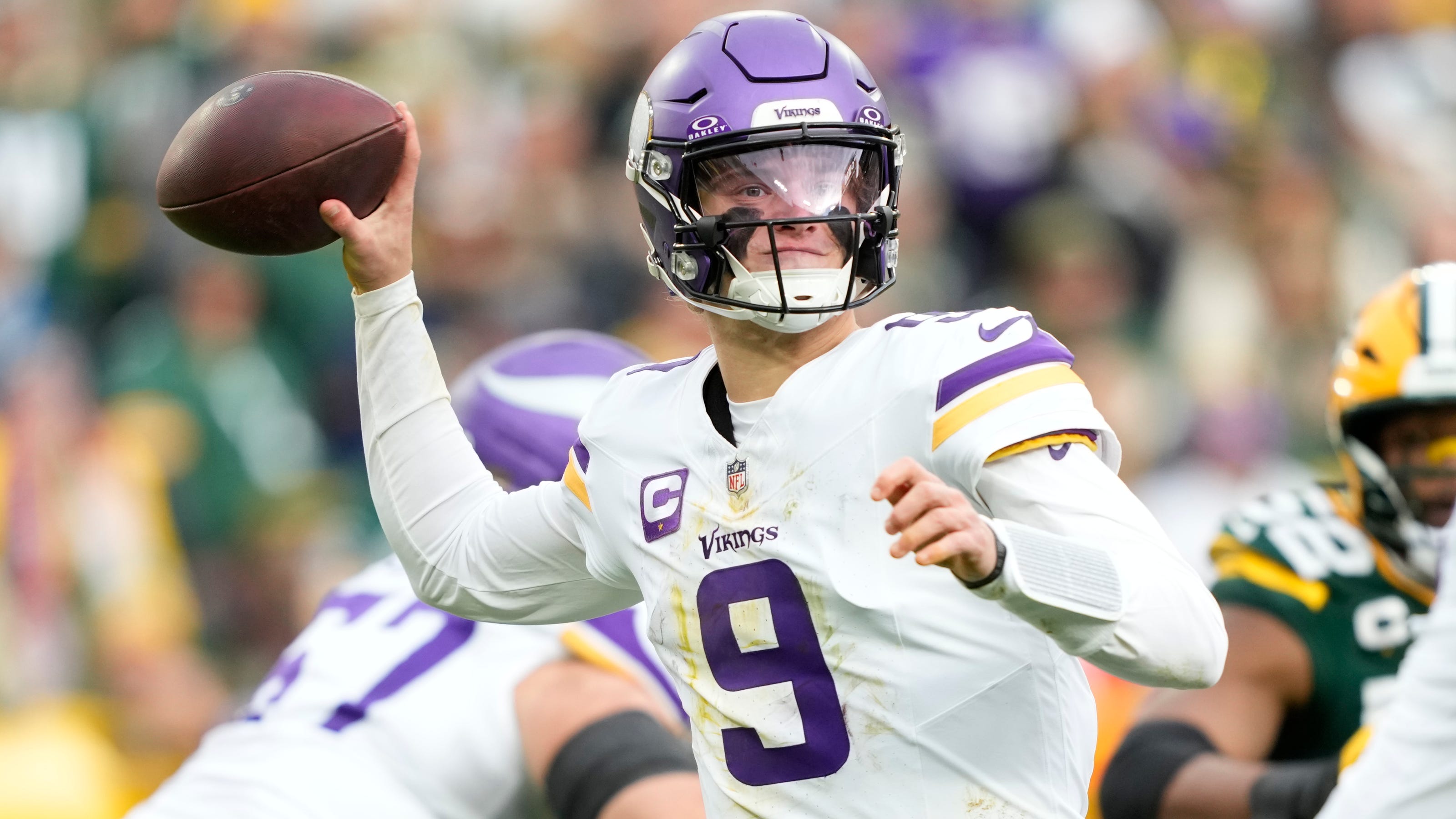 J.J. McCarthy watches from the sideline after entering concussion protocol.