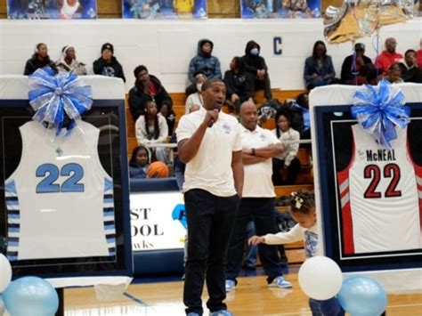 Jerel McNeal's jersey being raised to the rafters during his retirement ceremony.