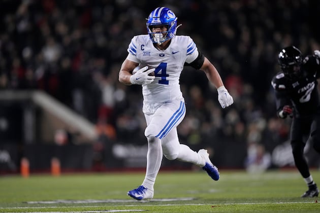 BYU star running back LJ Martin delivers a powerful run against Cincinnati.