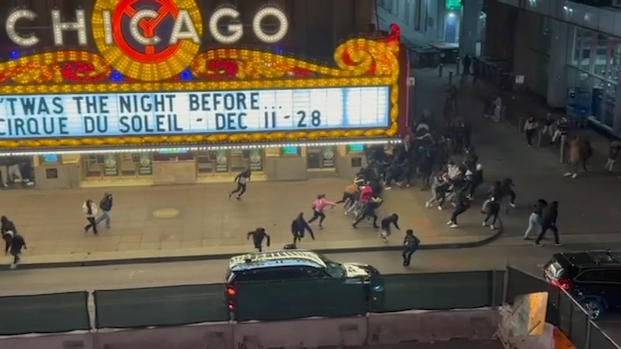 Police secured the area near Chicago Theatre following Friday night's shooting.