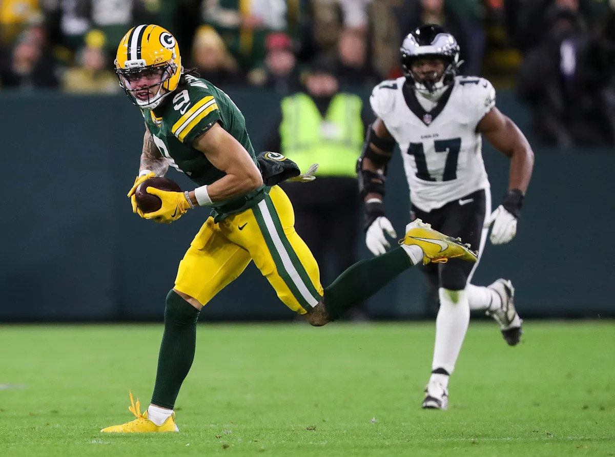 Christian Watson celebrates after a catch in his first game back from injury.