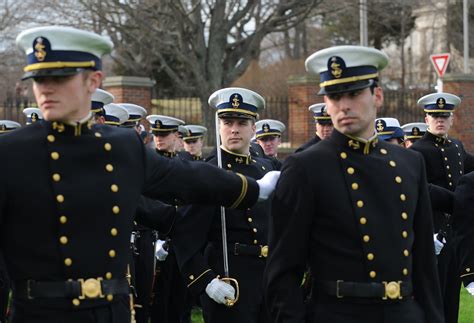 A U.S. Coast Guard cadet stands at attention during training.