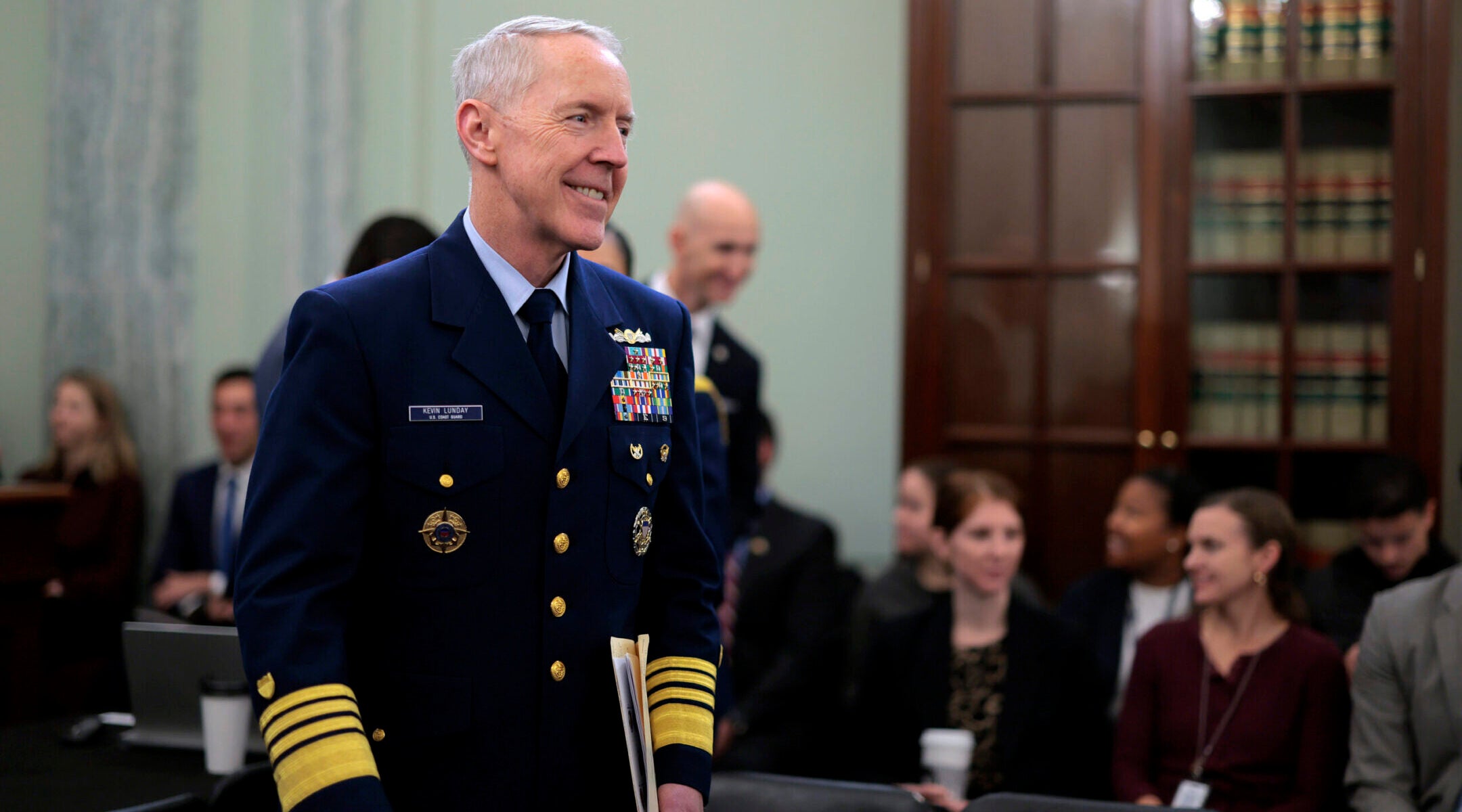 Admiral Kevin Lunday addresses media regarding the policy reversal.