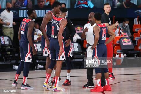 The Wizards gather during a timeout as they navigate a challenging season.