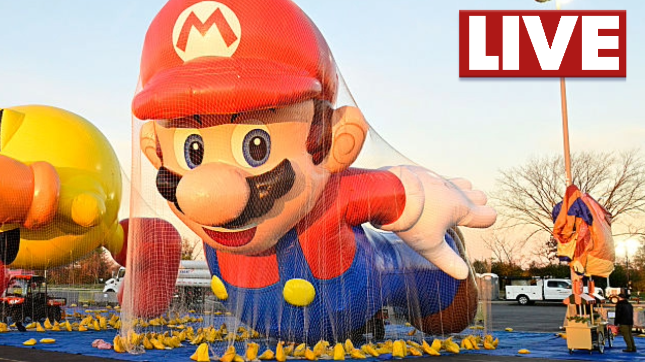 Workers inflate iconic balloons like Buzz Lightyear during the pre-parade celebration.