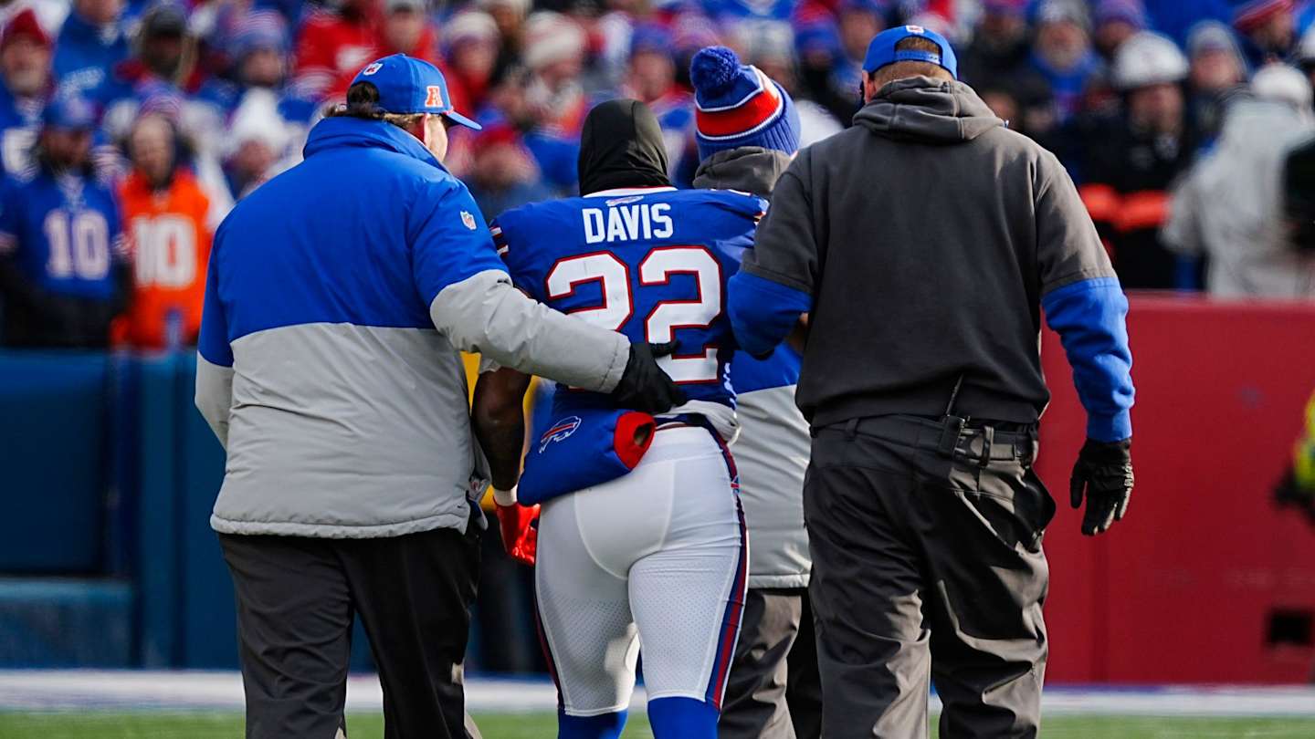 Medical staff evaluate Darius Slay for a concussion on the sideline.