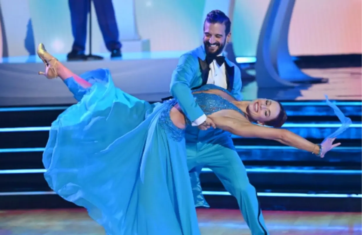 Hough celebrating his record-breaking DWTS victory with the iconic mirror ball trophy