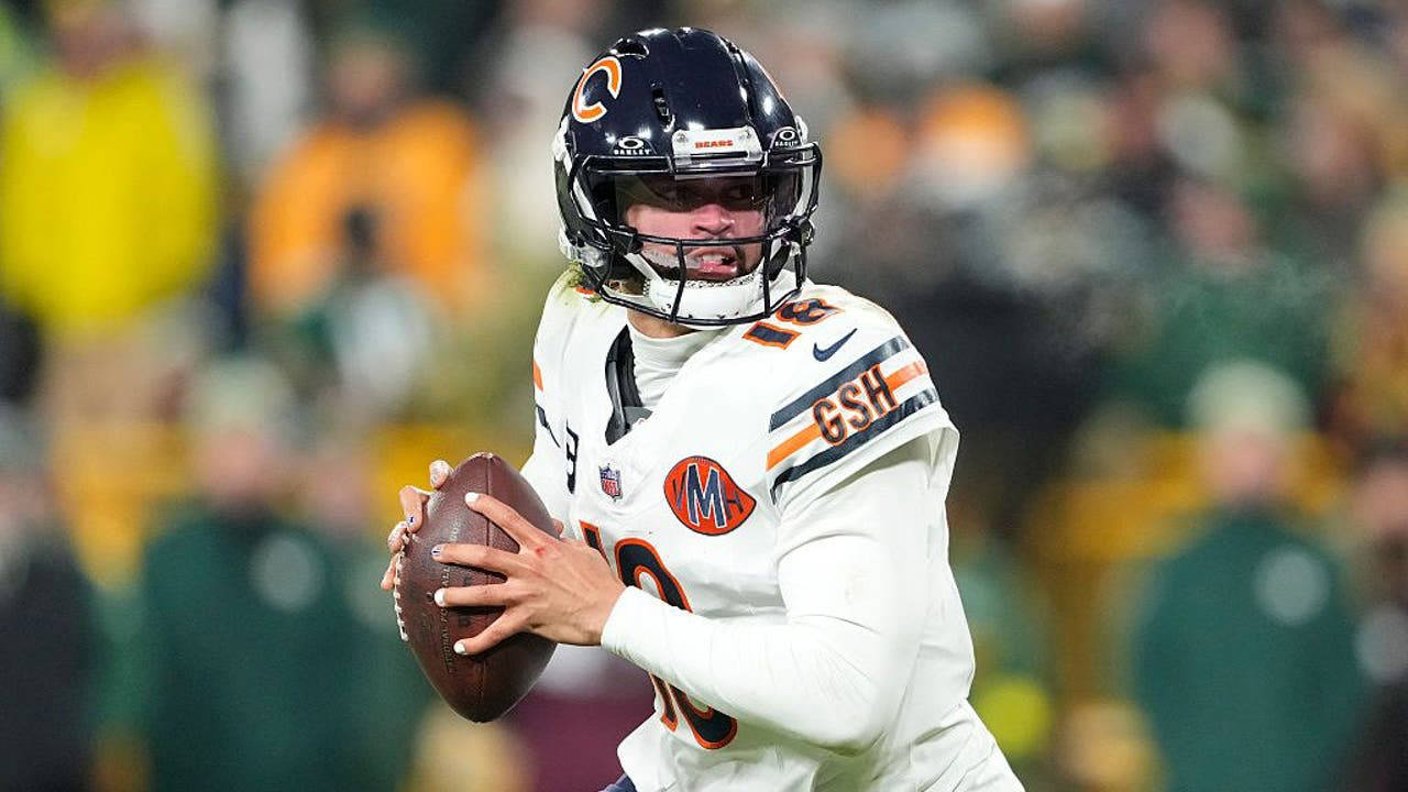 DJ Moore and quarterback Caleb Williams working together on the field