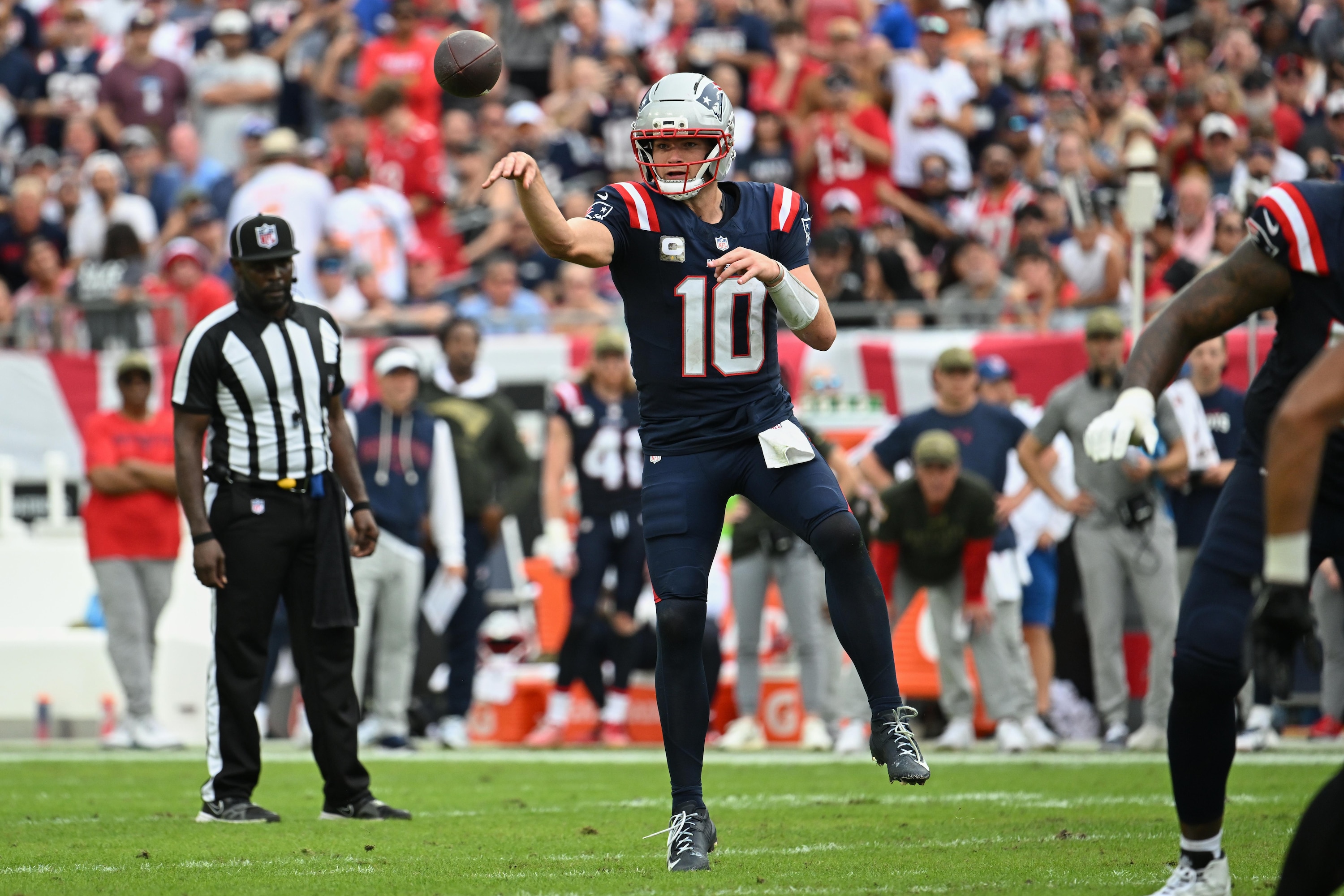 Patriots supporters celebrate during a Drake Maye touchdown drive.