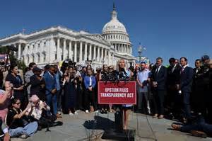 Rep. Marjorie Taylor Greene addresses reporters with Epstein abuse survivors.