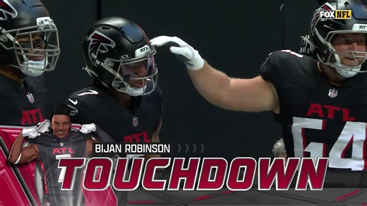 Bijan Robinson breaks tackles on his way to a touchdown against the Panthers.