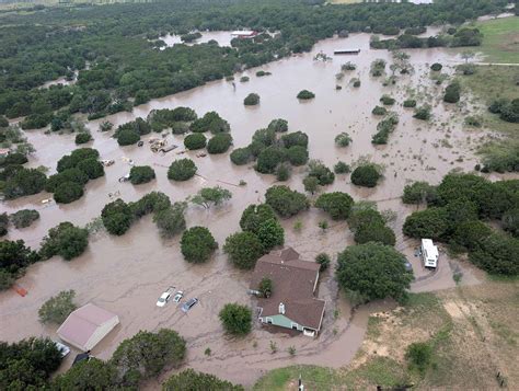 Emergency responders navigating flooded streets in Texas during July 2025 flooding.