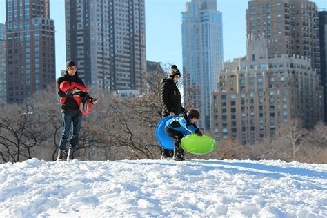 Residents enjoy sledding in Central Park during the Northeast's first significant snowfall of the season.