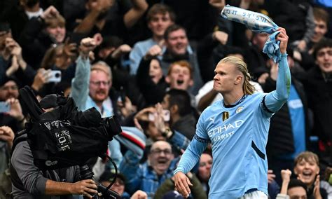 Erling Haaland celebrates scoring his historic 100th goal for Manchester City.
