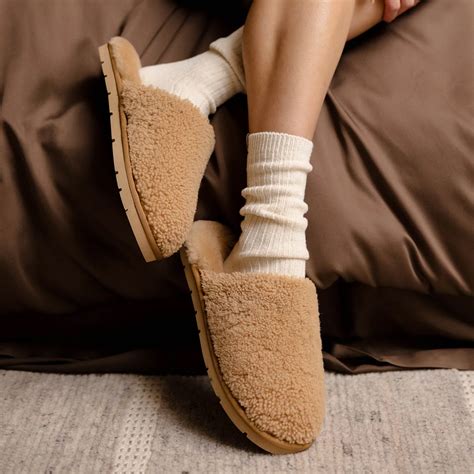 Cozy Earth's plush blankets and slippers at 50% off, offering luxurious comfort for holiday relaxation.
