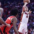 A competitive moment between the Heat and Rockets during the 2024-25 season.