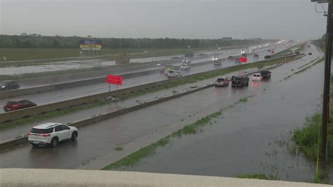 Flood advisory signage warns drivers of hazardous conditions in Harris County.