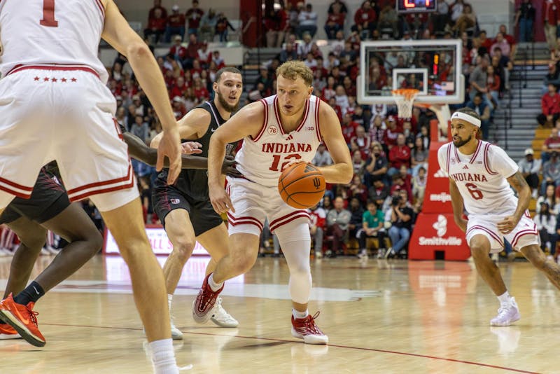 Indiana's Tucker DeVries drives to the basket during a 2025-26 game.