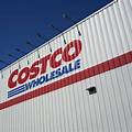 A bustling Costco warehouse showcasing the store's signature bulk offerings and high-traffic shopping experience.