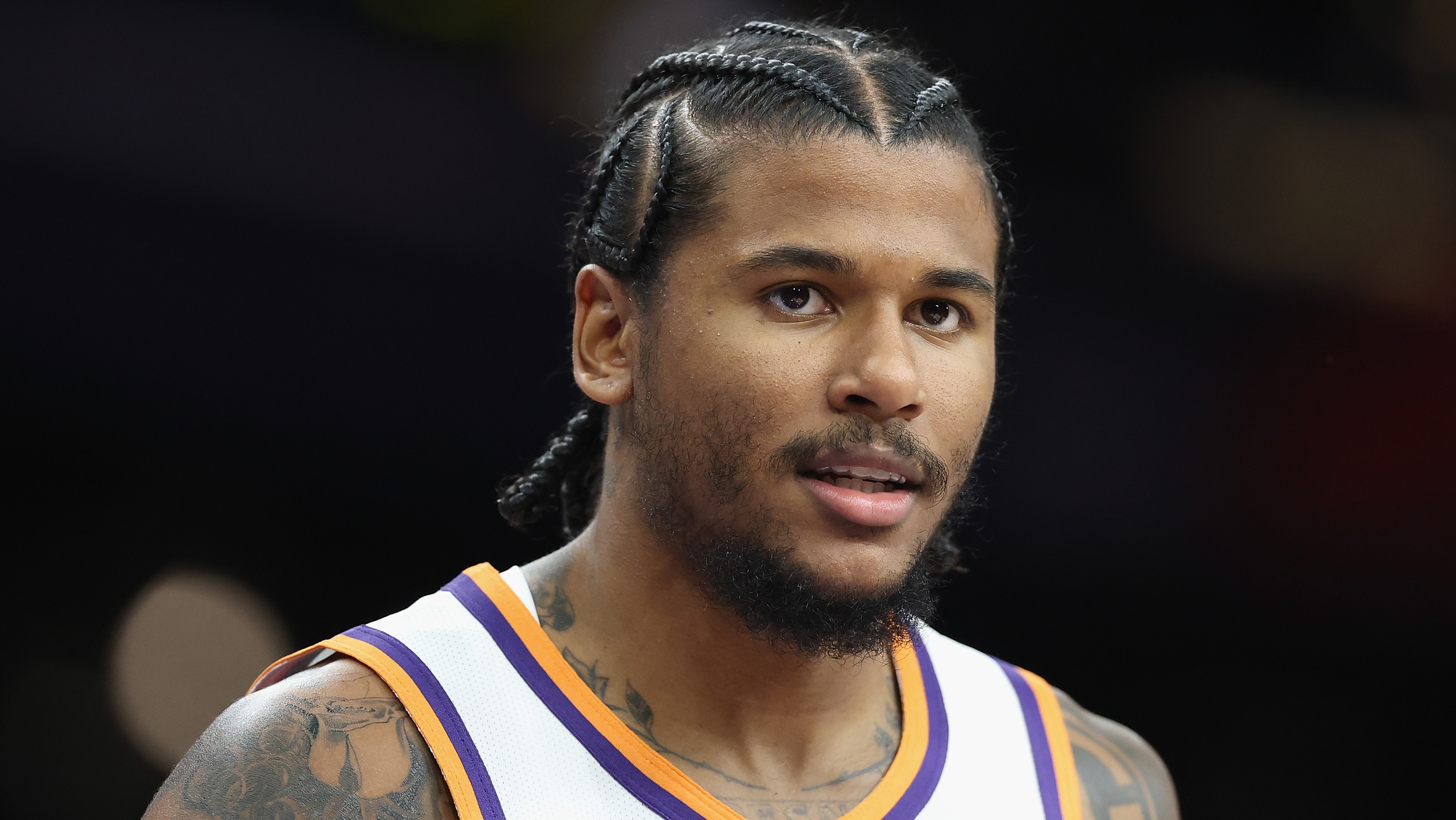 Medical staff assist Jalen Green off the court after suffering his hamstring injury