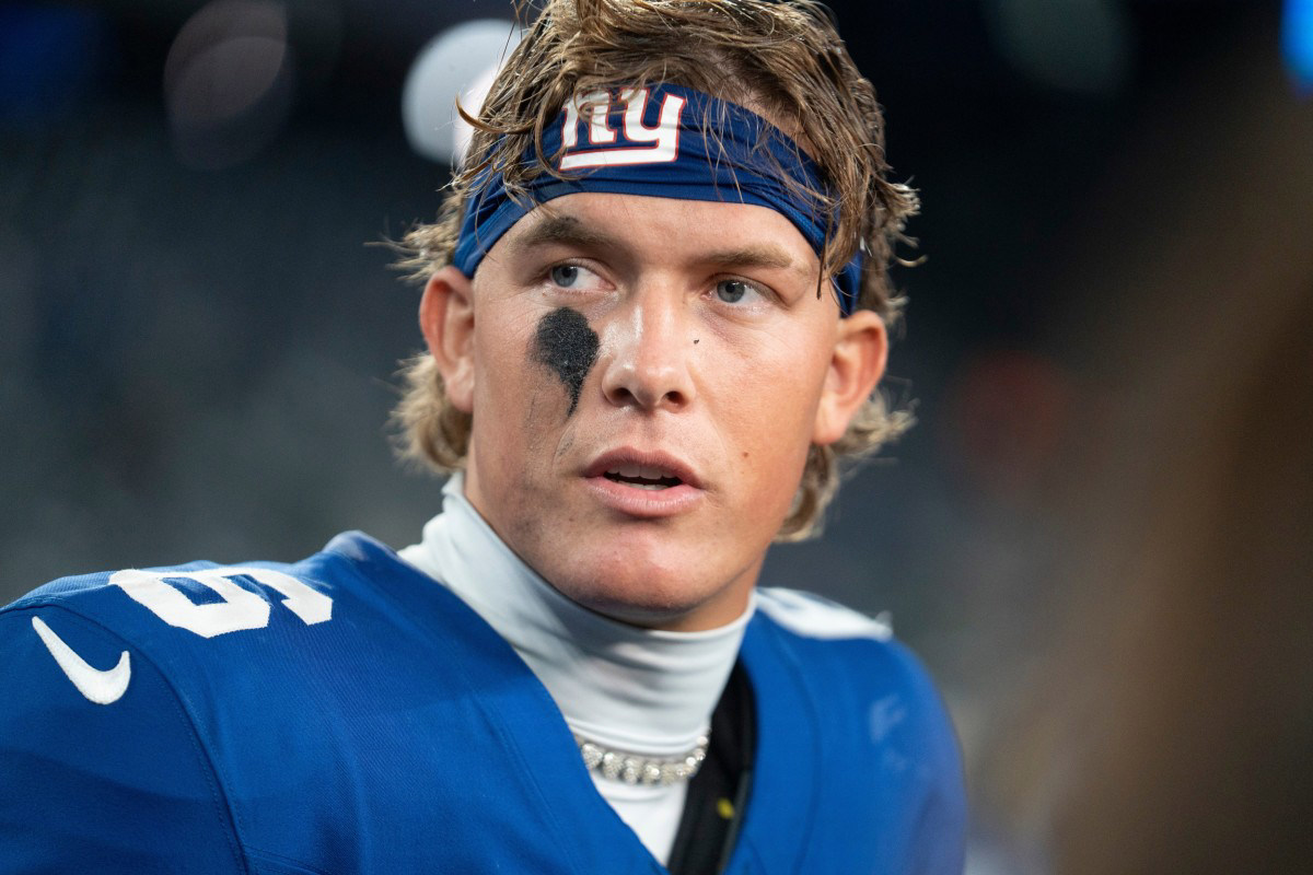 Dart absorbs a helmet-to-helmet hit from 49ers linebacker Tatum Bethune during a fourth-quarter scramble.