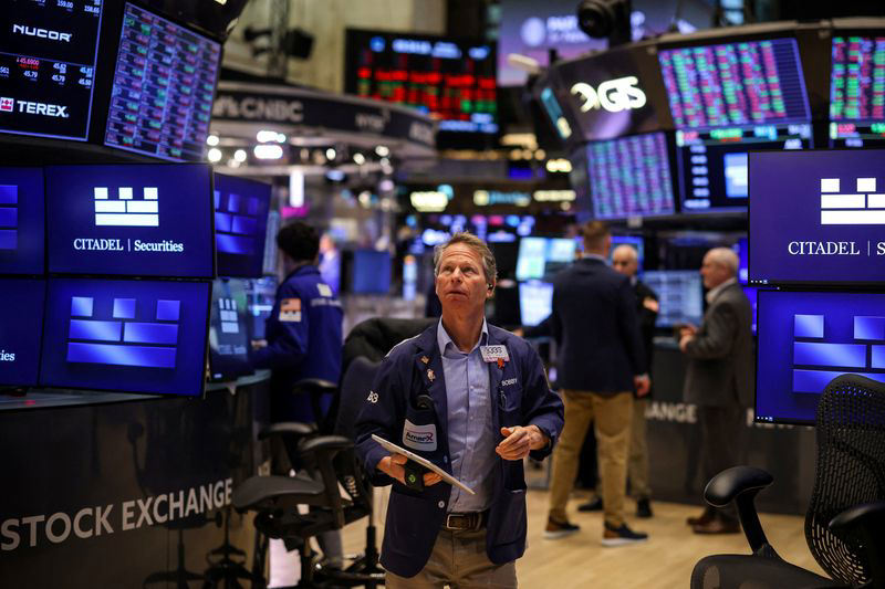 Traders monitor Fed Chair Powell's speech for market-moving signals.