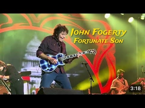 Fogerty showing off his impressive guitar skills during a solo portion of the show.