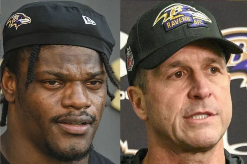 Harbaugh mentoring quarterback Lamar Jackson during training camp.
