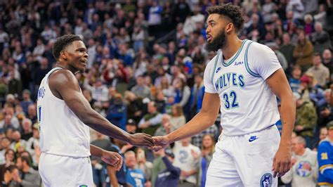 Towns celebrates with teammates after a critical playoff victory.