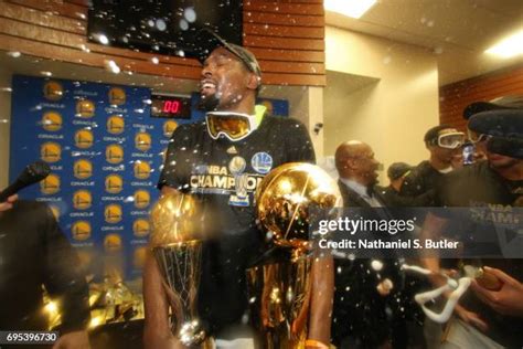 Durant celebrates his first Finals MVP award with the Warriors.
