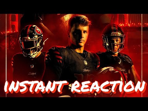 The 49ers gather in their pre-practice huddle during inclement weather conditions.