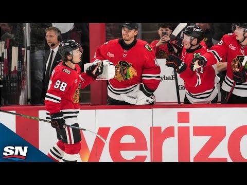 Connor Bedard celebrates after scoring his third goal against Calgary