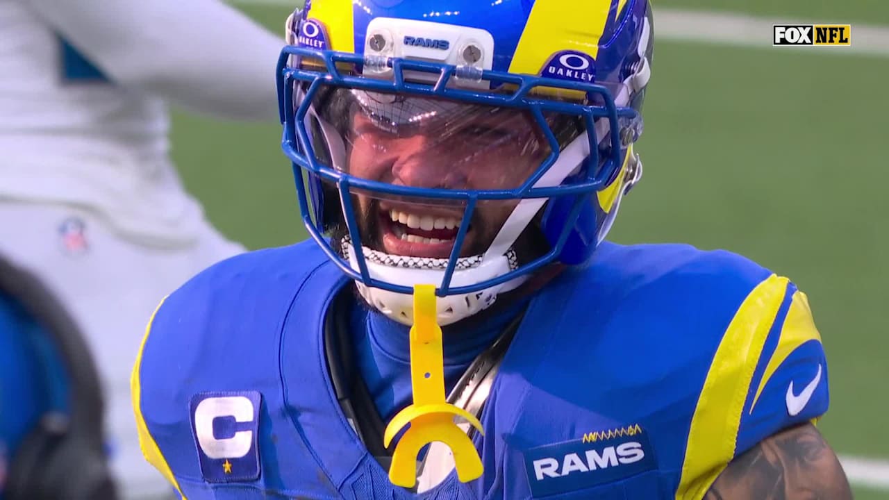 Kyren Williams somersaulting for a 19-yard run against the Detroit Lions, showcasing his agility.