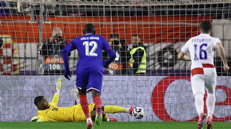 Mike Maignan makes a crucial late save to keep Milan in the Coppa Italia tie.