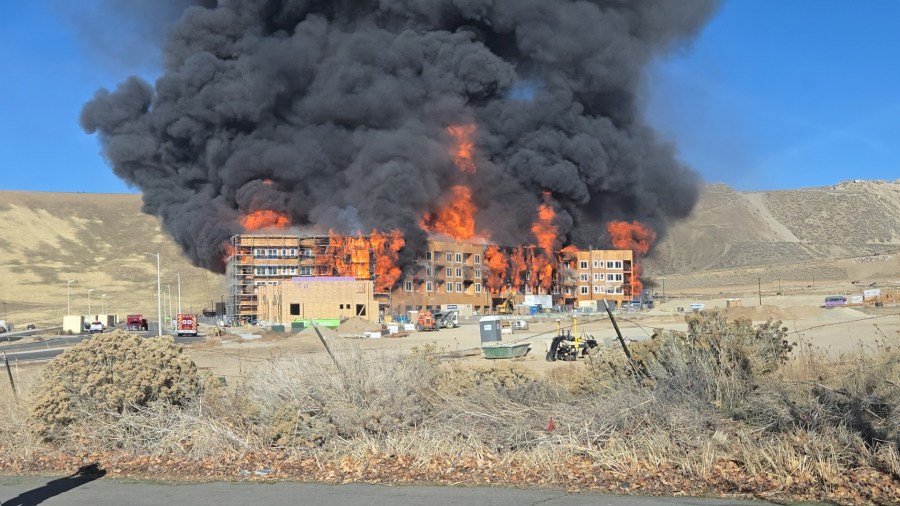 Firefighters battle the intense flames at the Alta Vista development site.