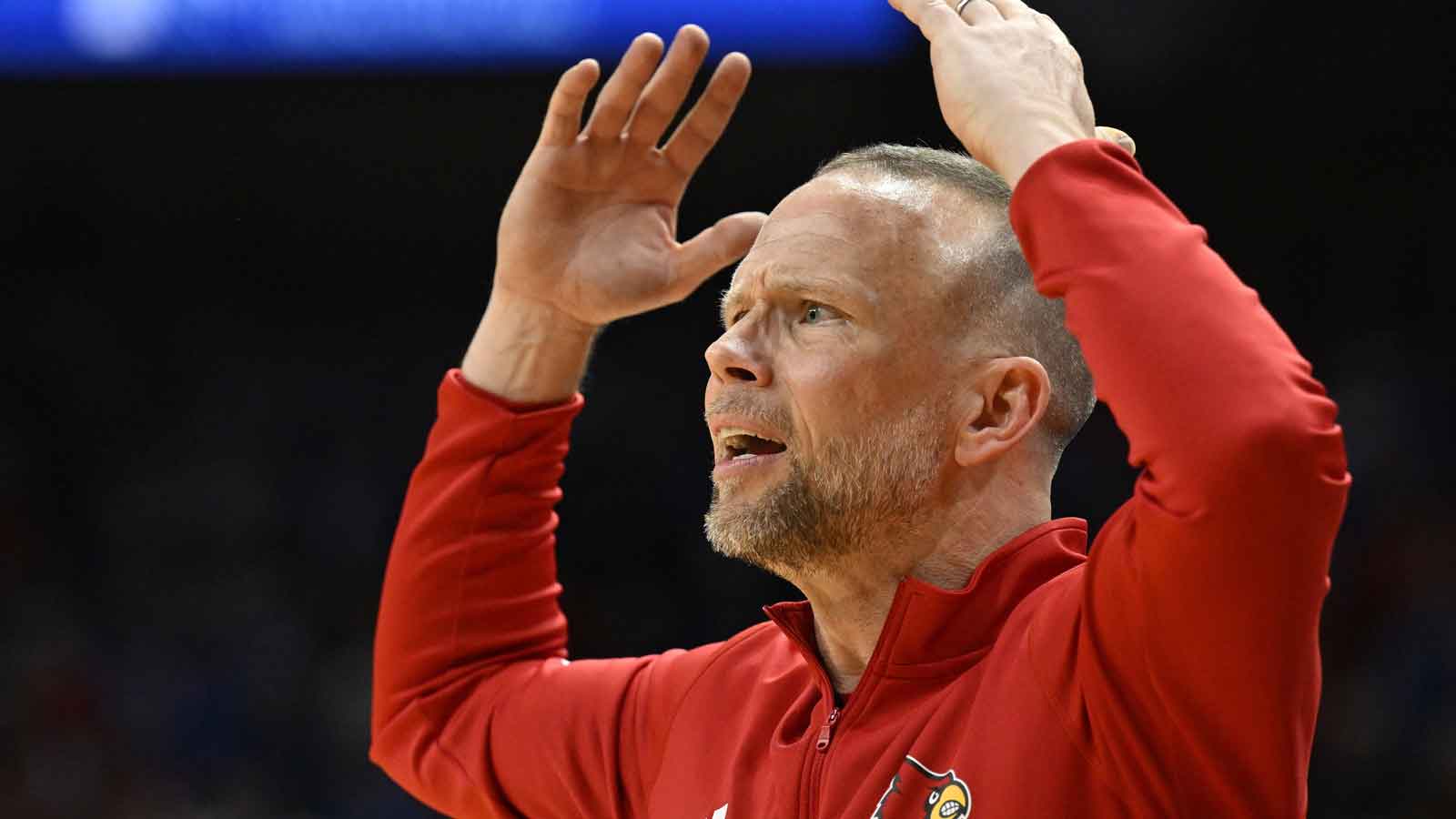 Louisville head coach Pat Kelsey sidelines during the win against Kentucky.