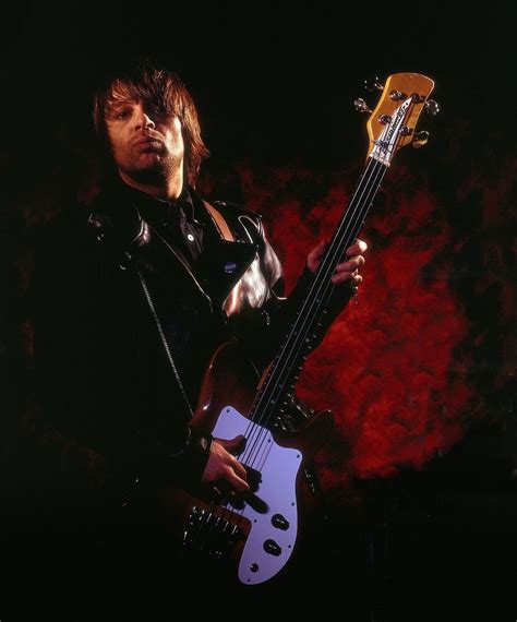 Mani performing with Primal Scream in 2011