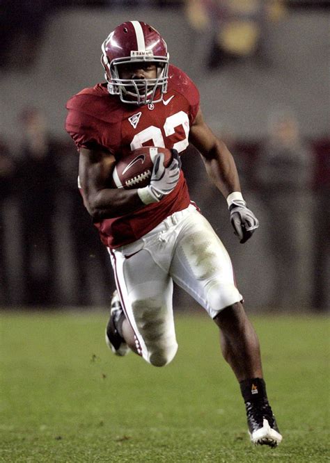 Ingram holding the Heisman Trophy after his historic 2009 season at Alabama.