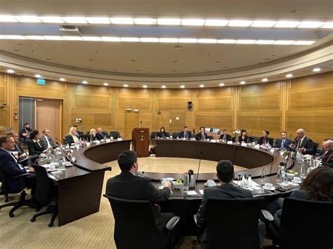 Senator Mark Kelly collaborating with fellow legislators on Capitol Hill.